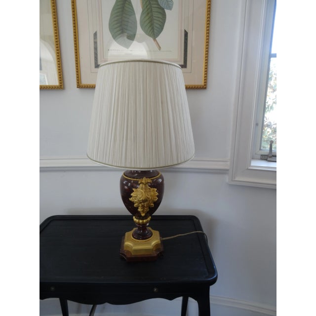 Elegant Gilt Bronze and Rouge Marble Lamp with Oval Silk Shade. An elegant edition to any room.