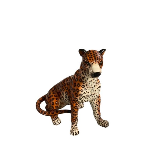 Bring a bold, glamorous statement to your interior space with this striking vintage life-size glazed ceramic leopard...