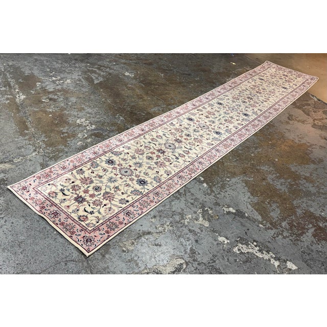 Design Plus Gallery presents a 2ft 6 in X 13ft 6 in Persian Style Floral Wool Runner Rug. This elongated runner showcases...