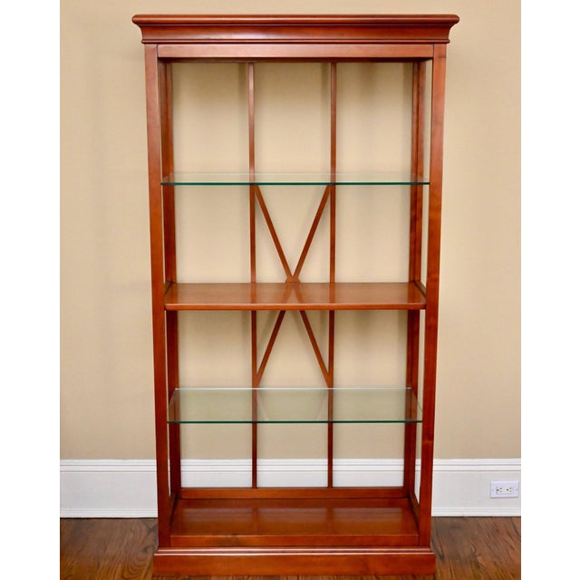 Pair of French Grange cherry wood étagères with glass shelving, featuring a refined open-frame design ideal for displaying...