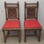 A Pair Jacobean Style Carved Oak and Caned Seat Side Chairs with red cushions Measures 17.5" in with, 17.5" in depth and...