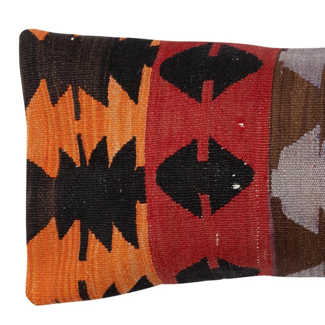 Add a touch of history and warmth to your space with this vintage handmade Turkish wool kilim cushion cover. Crafted from...