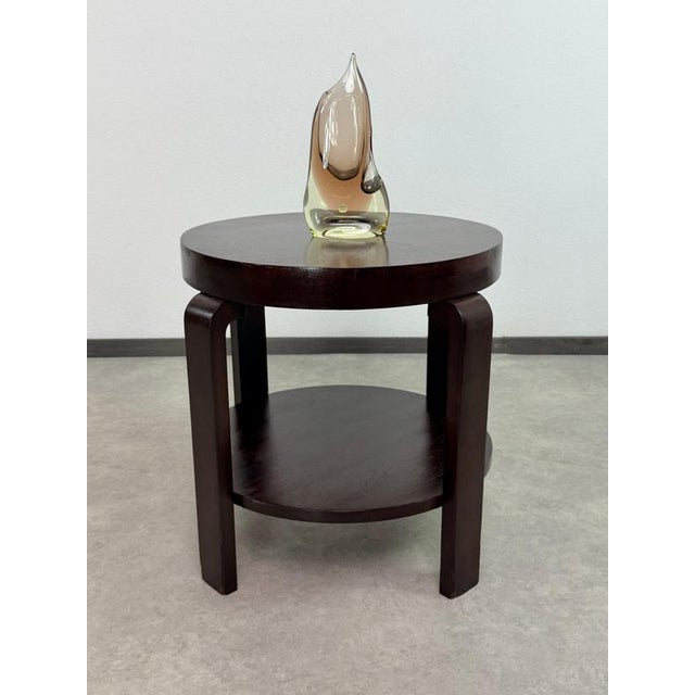 An elegant, restored Art Deco round side or cafe table, manufactured between 1920 and 1940 by the iconic modernist...