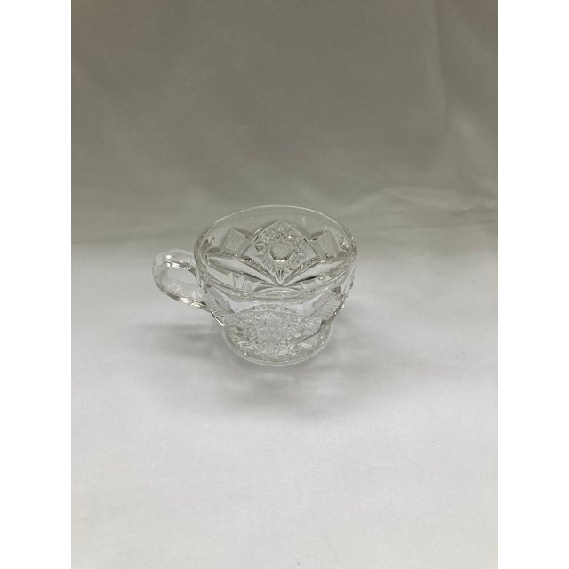 A set of 8 Vintage Pressed-Glass Punch Cups with Hobstar pattern, a classic geometric star motif featuring deep,...