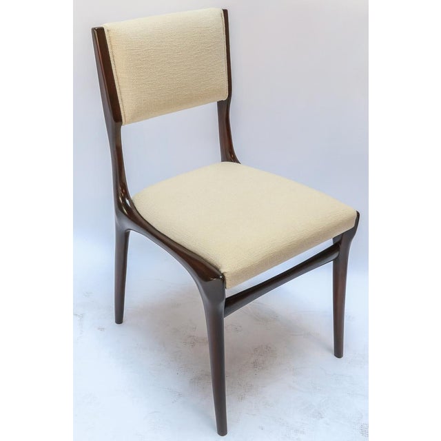 Set of 12 Carlo de Carli attributed dining chairs from the 1950s in a lovely brown finish upholstered in ivory / beige...