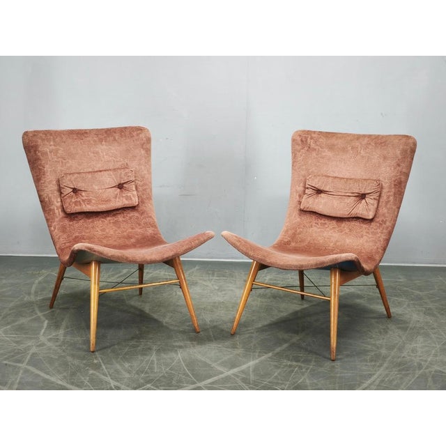 Exceptional pair of shell lounge chairs designed by Miroslav Navrátil and produced in Czechoslovakia during the 1960s....
