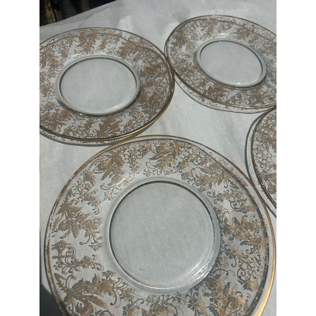 Up for consideration is a beautiful vintage Fostoria glass yellow Versailles collection of plates with gold accents. These...