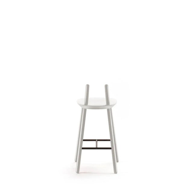 The Na&iuml;ve semi bar stool stands out for its unique and recognizable character. The carved seat with a minimal...