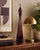 A stunning vintage Italian Empoli genie bottle crafted in rich amethyst art glass during the Mid-Century Modern era. This...