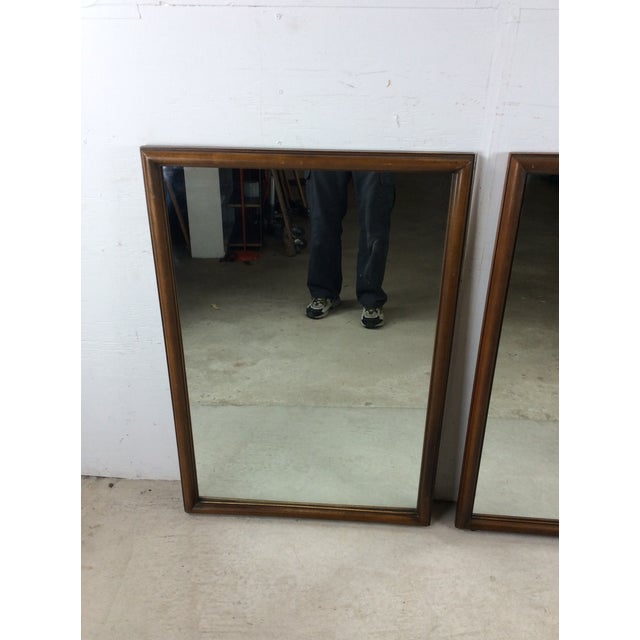 This pair of mid century modern mirrors feature beveled walnut frames with slight rounded edge, original walnut finish,...