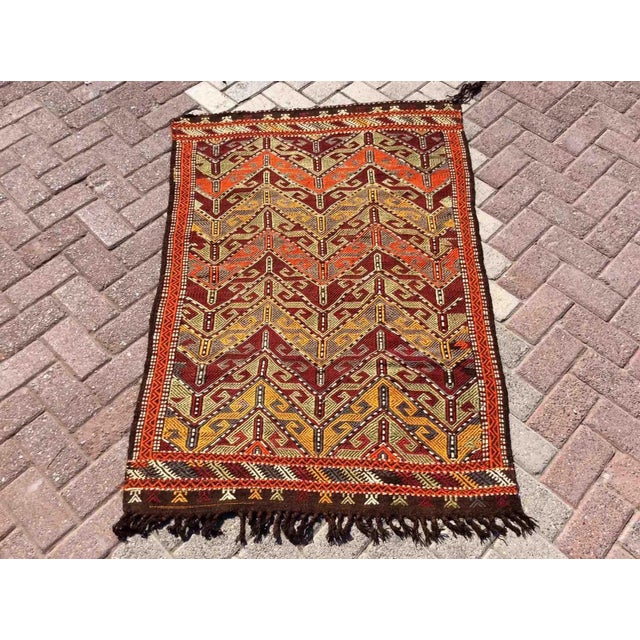 This beautiful, vintage, handwoven kilim is approximately 60 years old. It is handmade of very fine quality, hand-spun...