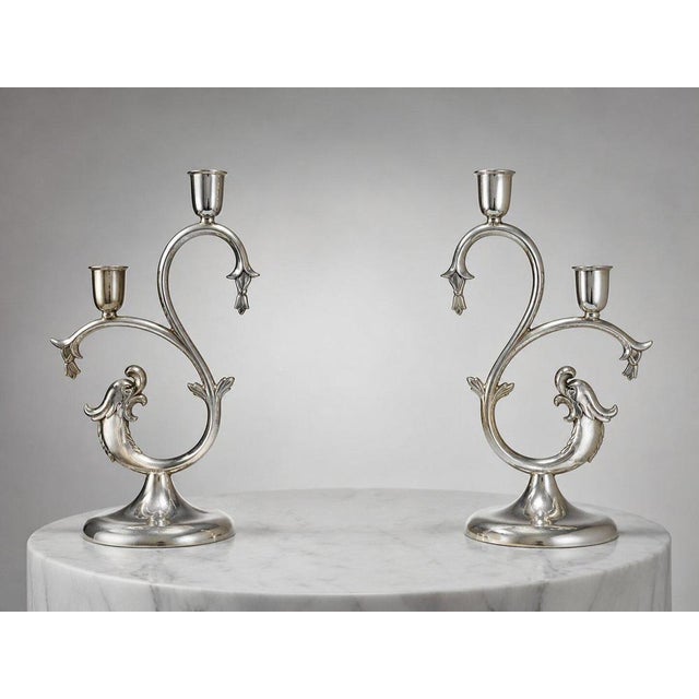 A striking and sculptural pair of pewter candleholders designed by Knut Eriksson & Co. for Svenskt Tenn, Sweden, circa...