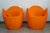 Set of two "O-Nest" armchairs by Tord Boontje for Moroso, 2006. Made of recyclable, mass-dyed orange polyethylene; light-...