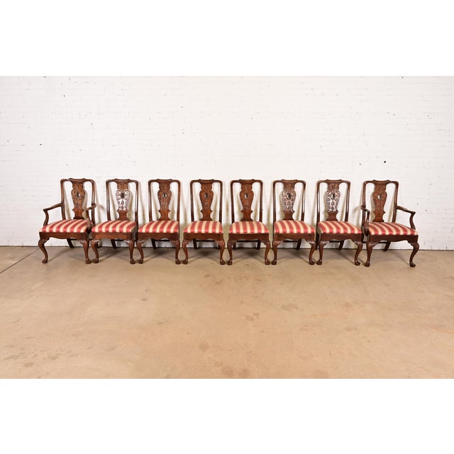 An outstanding set of eight Chippendale or Georgian style dining chairs By Henredon USA, Circa 1980s Carved solid mahogany...