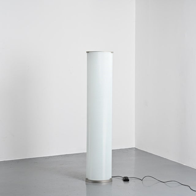 Pirellone floor lamp, model 2758, designed by Gio Ponti in the 1960s. The cast aluminum base supports a pressed glass...