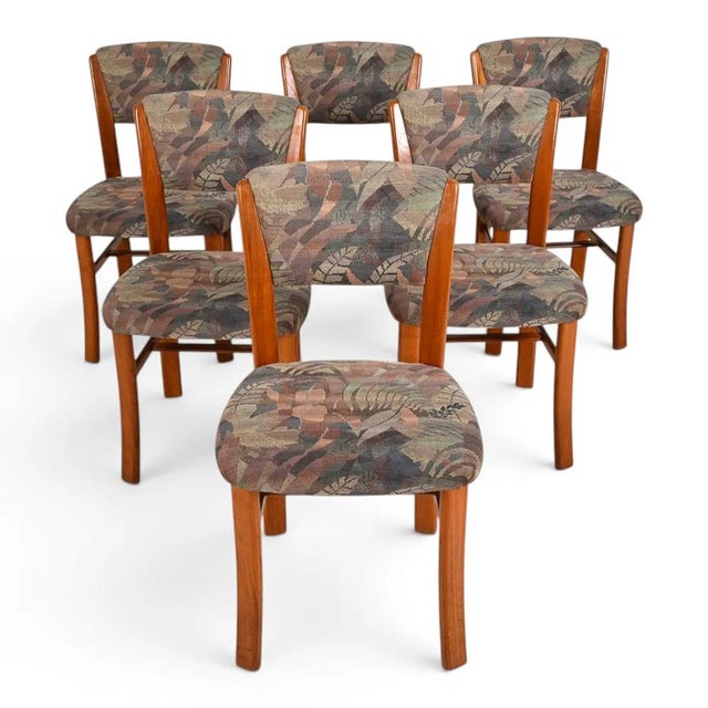 A very nice set of 6 teak Danish mid-century modern dining chairs. The chairs are well constructed of teak wood and are...
