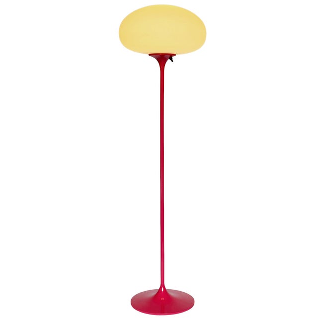 A sleek low profile floor made by Design-Line. It features a cast aluminum main base in a sculptural tulip form. The lamp...