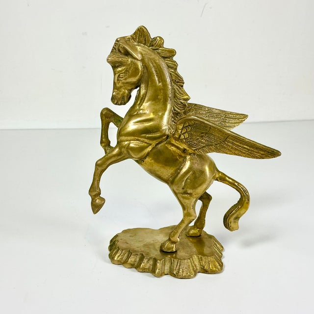 Vintage Home is pleased to present this cast brass sculpture of a mythical flying Pegasus horse. The two wings are highly...