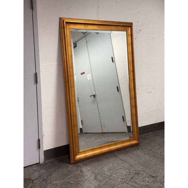 Design Plus Gallery presents a Custom Design Wall / Leaning Mirror. This mirror is wood in a gold finish that adds visual...