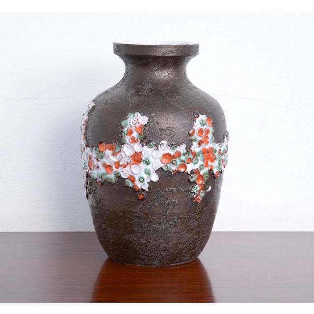 This black ceramic vase was designed and made in the workshop of Perignem in the early 1970s. It is a classic-shaped vase...