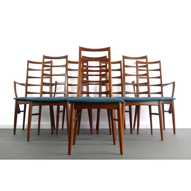 Stunning set of eight (8) vintage modern dining chairs feature unique ladder back rests and upholstered seats. Sleek...