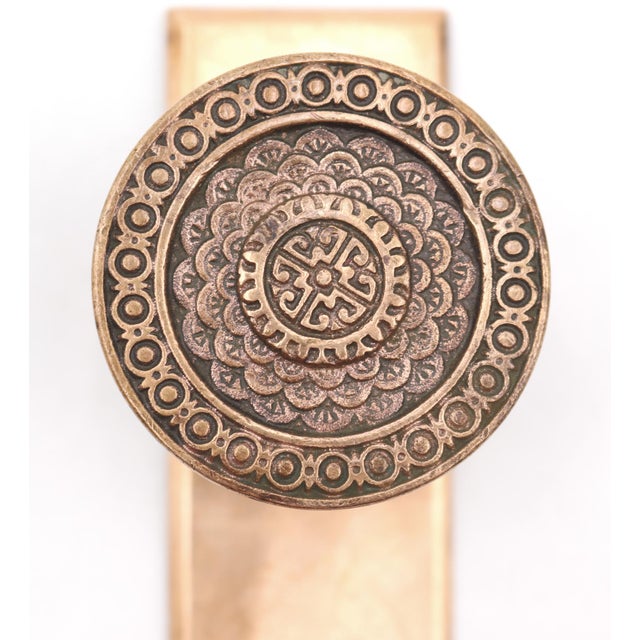 These Vernacular style field design dummy brass door knobs were made by Corbin in the 1884 catalog. It is part of D-10100...