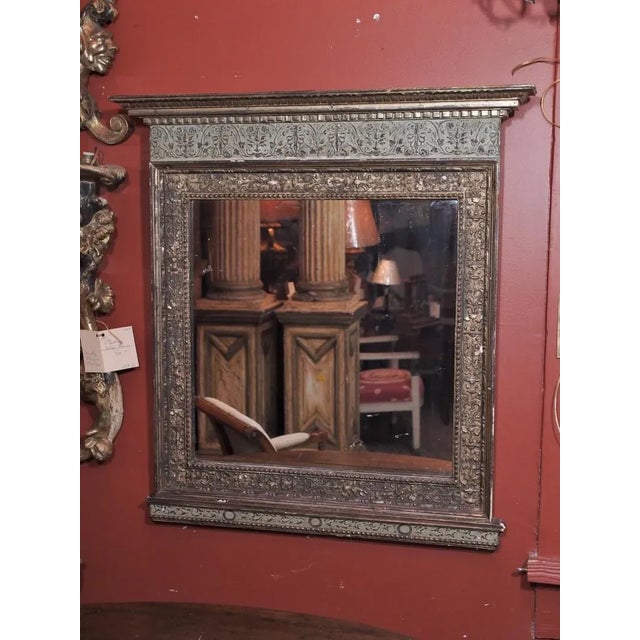 A very pretty silver gilt carved wood Italian mirror with flowers and acanthus leaf motif. The bottom is all painted by hand.