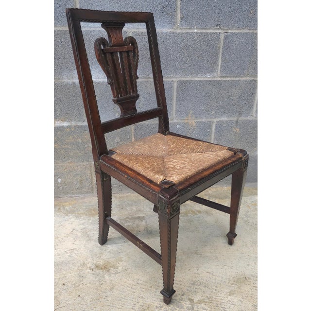An 18th Century Hand Crafted, Hand Carved Walnut and Rush Seat Side Chair. A collector's gem. Measures 16.5" in width, 16"...