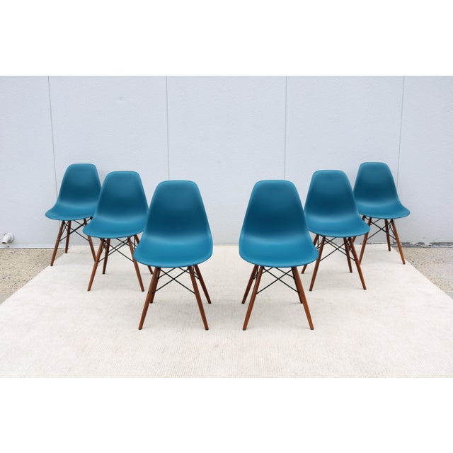 Fabulous set of 6 classic and iconic mid-century modern Eames molded plastic dining chairs in peacock teal blue shell and...