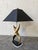 Absolutely stunning figural brass lamp with black acrylic and lucite base. Shade is solid brass and as heavy as the lamp....