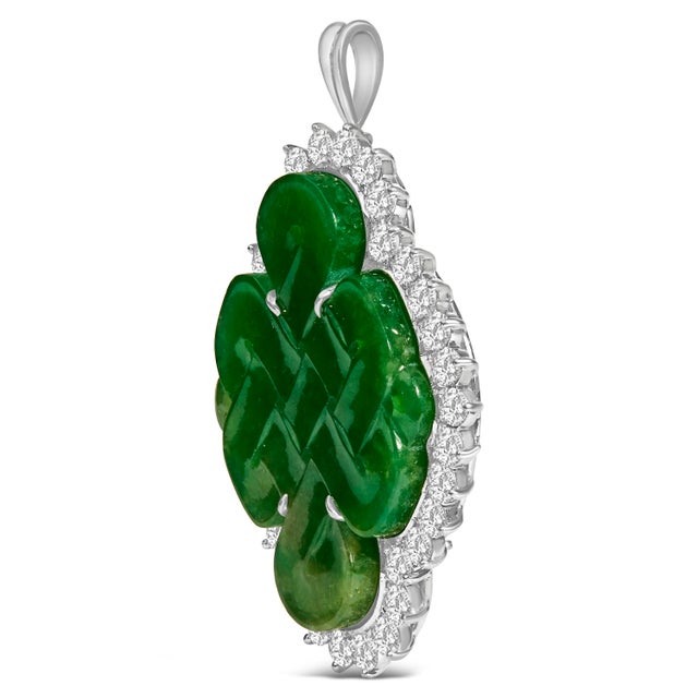 In an epoch where elegance intertwines with versatility, this masterfully crafted 18K white gold brooch and pendant...