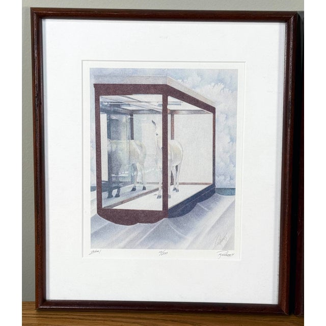 A compelling three piece set of limited edition surrealist prints, each depicting a zebra enclosed within a geometric...