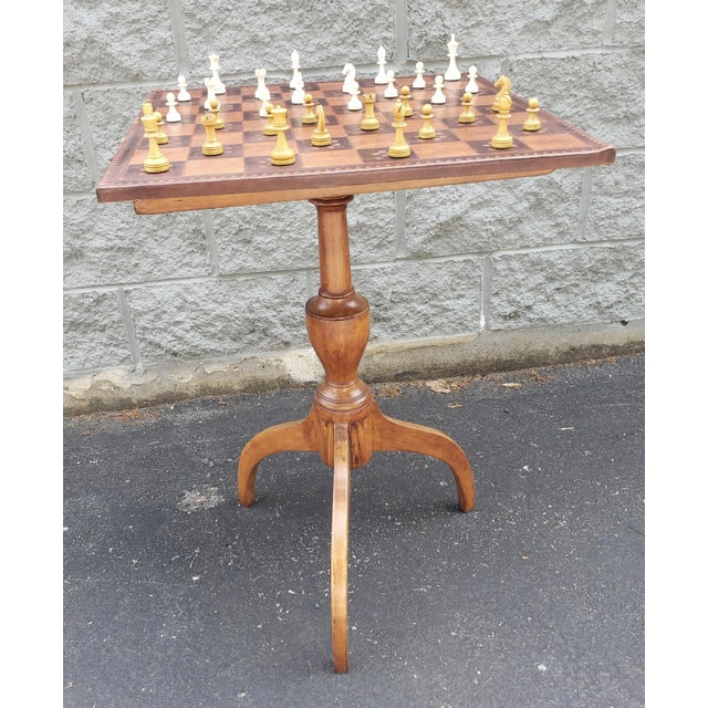 A 19th Century victorian Spider Legs Maple Table and Leather Top Chess Board and Pieces Set in good antique and condition....