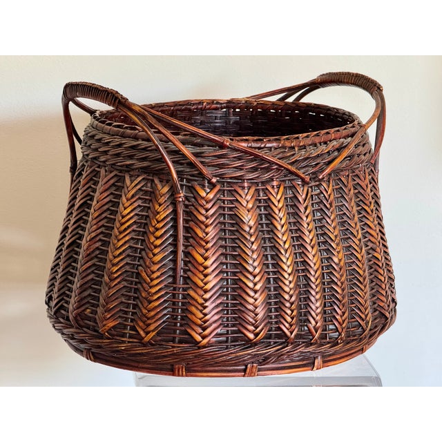 A large finely woven basket. Made for Ikebana, the traditional Japanese art of flower arranging.