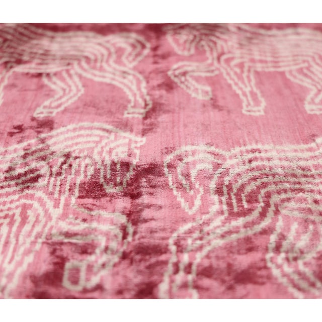 "Unexpected, artistic, and undeniably sophisticated, this handmade silk velvet pillow transforms a playful zebra motif...
