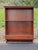 This mid-century modern cherry wood wall shelf brings functional vintage character to any contemporary interior. Crafted...
