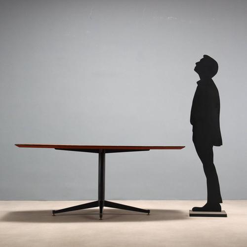 Vintage Italian-made dining table with black enameled metal base, brass feet, and teak wood top. Decent condition. This...