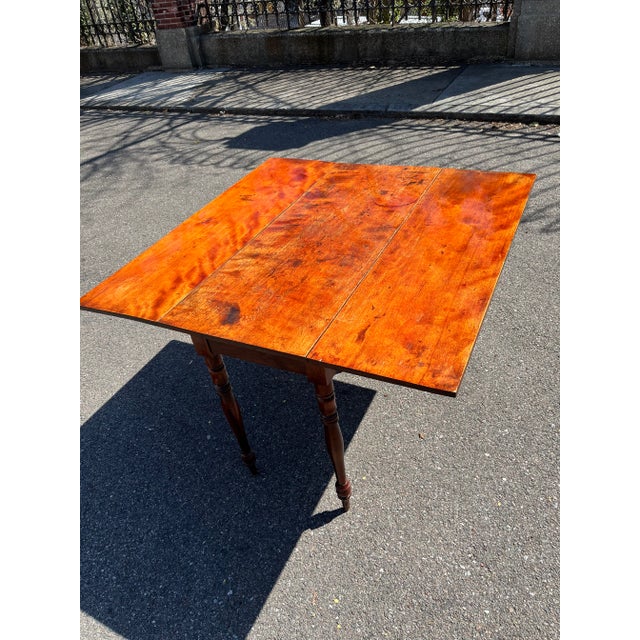 19th century American drop leaf table In cherrywood on turned legs Great color finished with shellac and wax