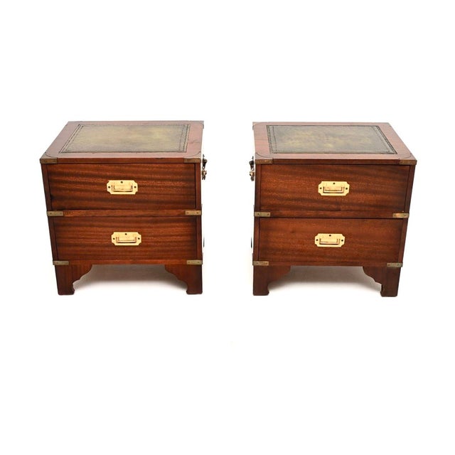 A wonderful pair of antique military campaign style bedside chests. They were made in England, and date from around the...