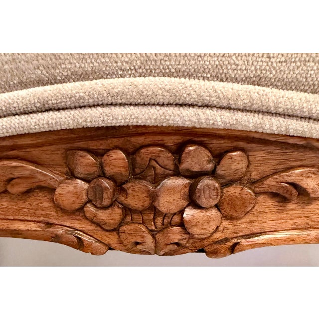 Antique Carved Louis XV Walnut Footstool. Curvy shape newly upholstered in gray Chenille with double welting. Good overall...