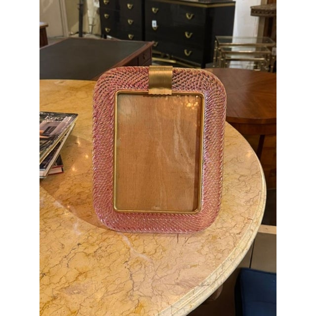 The Pink Murano Twist Glass Picture Frame is a beautifully crafted home décor item that adds a touch of elegance to any...