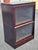 Early 20th Century Lundstrom Sectional Barrister Mahogany Low Bookcase with glass doors. Four-part, top. Base and two...