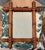 A charming antique French wall mirror featuring turned faux bamboo frame in richly honey patinated fruitwood. The...
