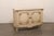 A French painted wood two-door buffet console from the early 20th century. This antique cabinet from France has a...