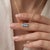 Embrace cool, brilliant sophistication with this stunning two-stone pendant necklace, featuring two clear, sky-blue oval...