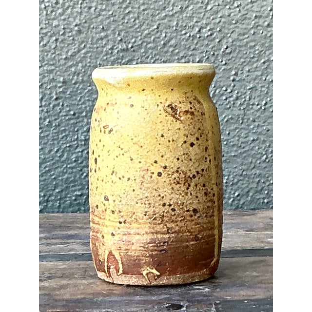 Infuse a sunny, rustic warmth into your home décor with this petite vintage studio pottery vase. Hand-thrown from robust...
