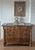 A handsome French Louis Philippe four-drawer commode in beautifully grained burled walnut with original black and white...