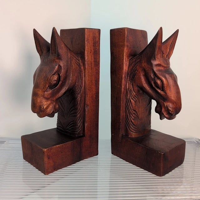 Add rustic elegance and timeless craftsmanship to your bookshelf with this **Vintage Pair of Hand-Carved Wood Horse Head...