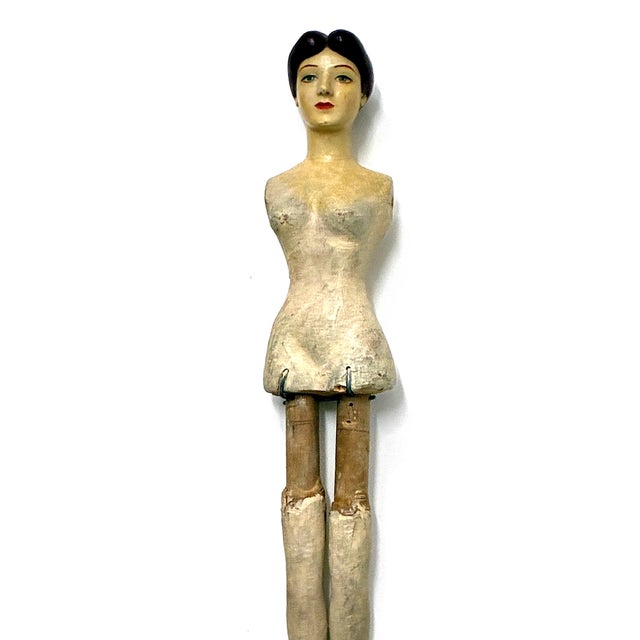 On offer is a doll with 19th-century styling, including a center-parted hairstyle and a hand-painted face. Like a...