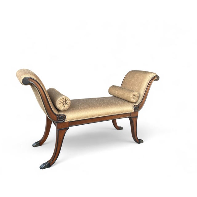 Elegant vintage mahogany bench featuring an iconic X-design frame with carved scroll arms and legs, ending in original...